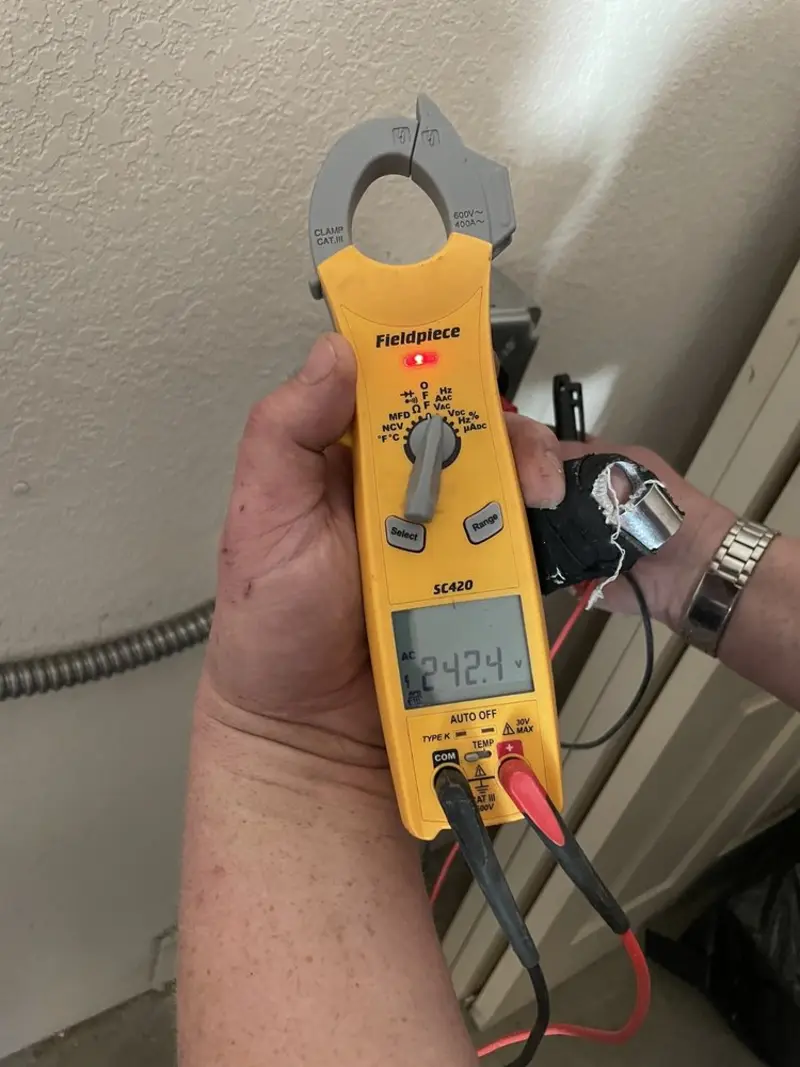 Voltage testing with clamp meter during Electrical Installation Services in Coal